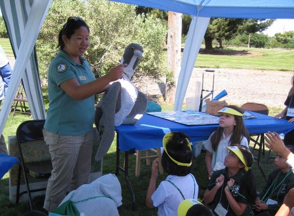 Third grade students learn about pollution prevention from the Watershed Watchers Coordinator at the Water Wizard Festival, held annually at the Guadalupe River Park & Gardens, San Jose, CA.